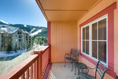 a balcony with two chairs and a view of a mountain at Expedition Station 8613 in Keystone
