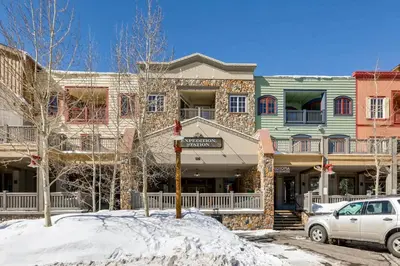 a white car parked in front of a building at Expedition Station 8613 in Keystone