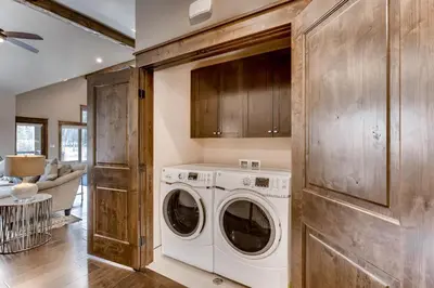 a laundry room with a washer and dryer at River Run Townhome RR37 in Keystone