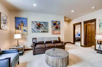 a living room with a couch and a table at River Run Townhome RR37 in Keystone