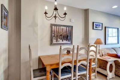a dining room with a wooden table and chairs at Buffalo Lodge 8385 in Keystone