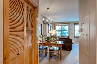 a kitchen and dining room with a table and chairs at Buffalo Lodge 8325 in Keystone