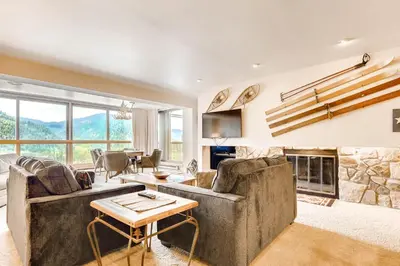 a living room with a couch and a fireplace at Sts, Johns 2541 in Keystone