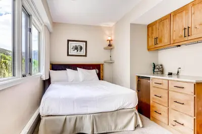 a small bedroom with a bed and a window at Sts, Johns 2541 in Keystone