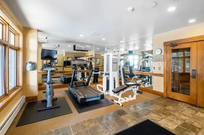 a fitness room with a gym with tread machines at Lone Eagle 3031 in Keystone