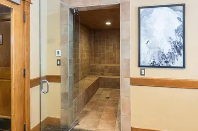 a walk in shower with a glass door at Lone Eagle 3031 in Keystone