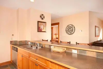 a kitchen with a sink and a counter at Springs 8848 in Keystone
