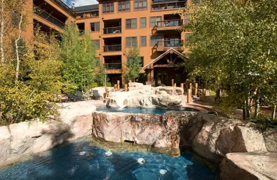 a pool of water in front of a building at Springs 8848 in Keystone