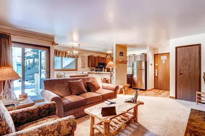 a living room with a couch and a table at Flying Dutchman 1210 in Keystone