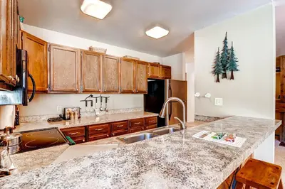 a kitchen with a sink and a counter top at Flying Dutchman 1210 in Keystone