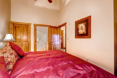 a bedroom with a large pink bed in a room at Red Hawk 2291 in Keystone
