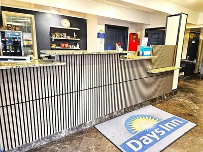 a restaurant with a davis sign on the floor at Days Inn by Wyndham Denver Downtown in Denver
