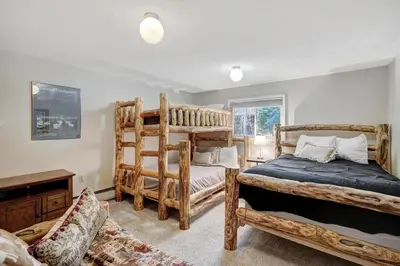 a bedroom with two bunk beds and a window at Lagoon 762B Townhouse in Frisco