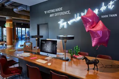 an office with a desk with a computer on it at MOXY Denver Cherry Creek in Denver