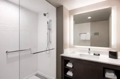 a bathroom with a sink and a shower at Residence Inn by Marriott Boulder Canyon Boulevard in Boulder