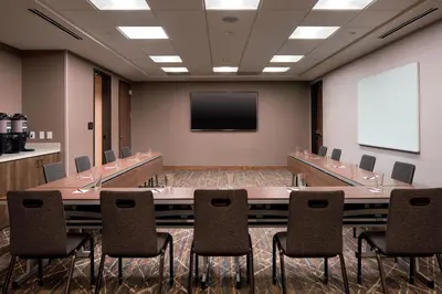 a conference room with a large table and chairs at Residence Inn by Marriott Boulder Canyon Boulevard in Boulder