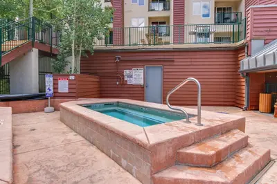 a swimming pool in front of a building at Iron Horse Studio in Winter Park