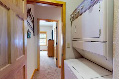 a hallway with a white oven in a room at Snake River Village in Keystone