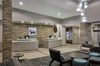 a lobby with a waiting area with chairs and tables at Residence Inn by Marriott Denver Southwest/Littleton in Littleton