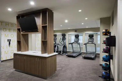a gym with tread machines and a flat screen tv at Residence Inn by Marriott Denver Southwest/Littleton in Littleton