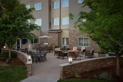 a patio with tables and chairs in front of a building at Residence Inn by Marriott Denver Southwest/Littleton in Littleton