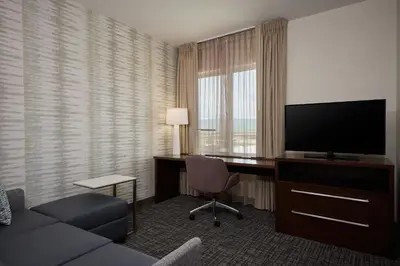 a hotel room with a desk and a television at Residence Inn by Marriott Denver Southwest/Littleton in Littleton