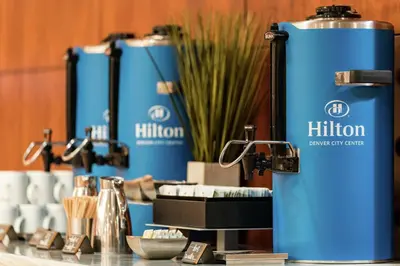 a display of hilion water cans on a table at Hilton Denver City Center in Denver
