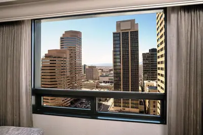 a view of a city skyline from a window at Hilton Denver City Center in Denver