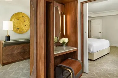 a hotel room with a bed and a bedroom at The Ritz-Carlton, Denver in Denver