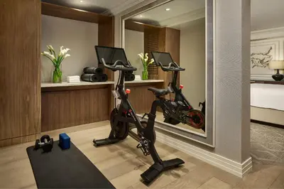 a room with a gym with two exercise bikes at The Ritz-Carlton, Denver in Denver