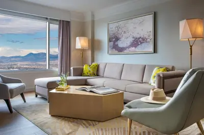 a living room with a couch and a table at Hotel Clio, a Luxury Collection Hotel, Denver Cherry Creek in Denver