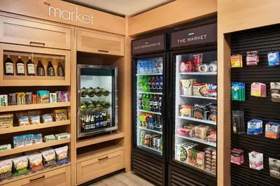 a grocery store with a refrigerator and lots of food at Residence Inn Denver City Center in Denver