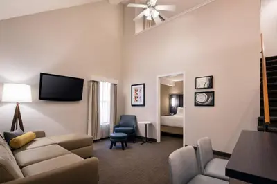 a living room with a couch and a tv at Residence Inn by Marriott Boulder in Boulder