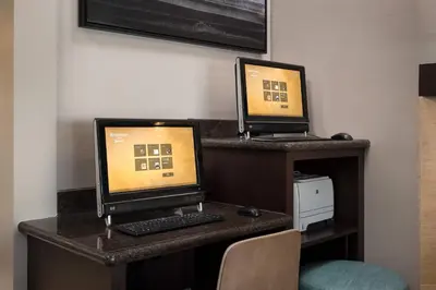 two computers sitting on a desk in a hotel room at Residence Inn by Marriott Boulder in Boulder