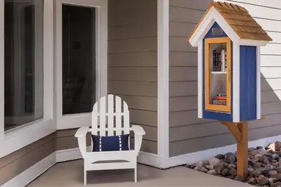 a chair and a bird house on a porch at Residence Inn by Marriott Boulder in Boulder