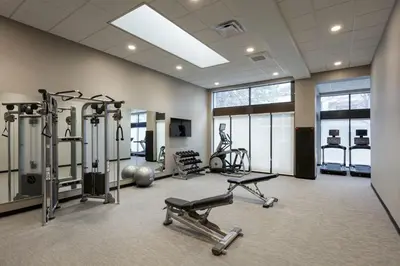 a gym with several exercise equipment in a room at Courtyard Denver Tech Center in Greenwood Village