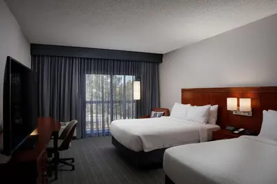 a hotel room with two beds and a window at Courtyard Denver Tech Center in Greenwood Village