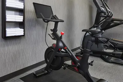 a room with a bike and a computer monitor at Courtyard by Marriott Fort Collins in Fort Collins