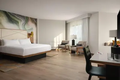 a hotel room with a bed and a desk at Fort Collins Marriott in Fort Collins