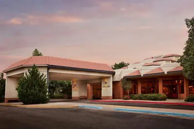 a hotel with a building in the background at Fort Collins Marriott in Fort Collins