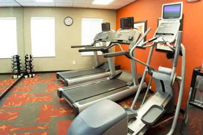 a gym with two treadmills and a treadmill at Residence Inn by Marriott Fort Collins in Fort Collins