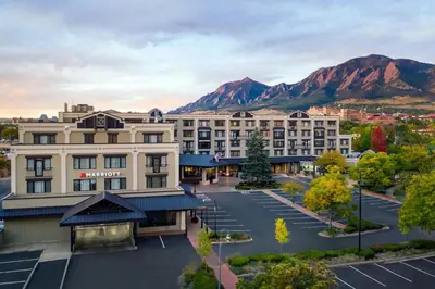 an aerial view of a hotel with mountains in the background at Boulder Marriott in Boulder