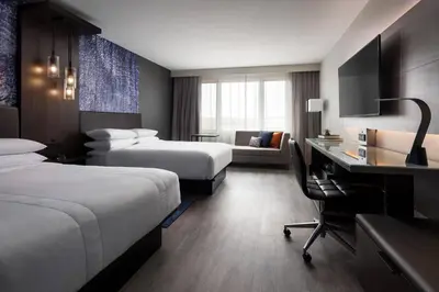 a hotel room with two beds and a desk at Boulder Marriott in Boulder