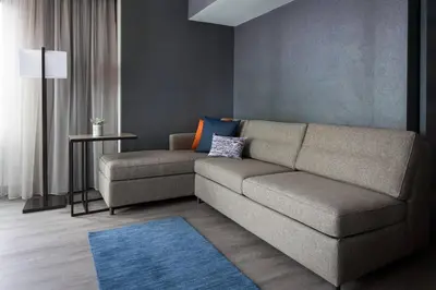 a living room with a couch and a table at Boulder Marriott in Boulder
