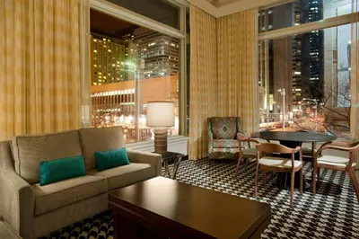 a living room with a couch and a table at Courtyard by Marriott Denver Downtown in Denver
