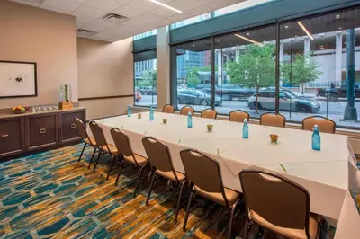 a conference room with a long table and chairs at Courtyard by Marriott Denver Downtown in Denver