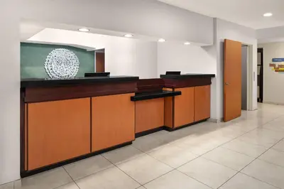 a lobby with a reception desk in a building at Fairfield Inn & Suites Denver Airport in Denver