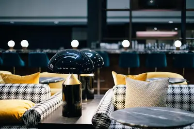 a room with couches and a table with a lamp at Renaissance Denver Hotel & Conference Center in Denver