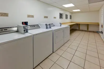 a laundry room with washing machines and a counter at SpringHill Suites Denver North / Westminster in Westminster