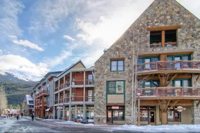 a large building with people walking in front of it at River Run Village 1 Bedroom Condo in Keystone